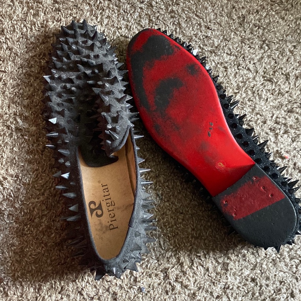 Black spiky red bottom dress shoes
